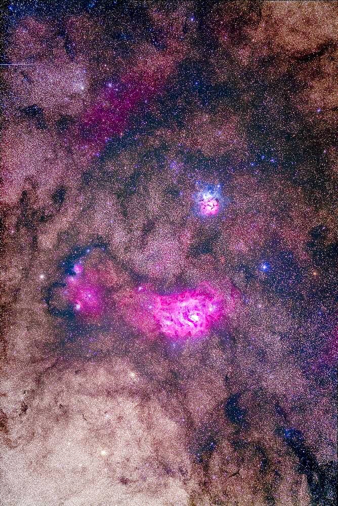 The spectacular field of Messier 8 and 20 emission and reflection nebulas in Sagittarius, with M8, aka the Lagoon Nebula below, and M20, the Trifid Nebula, above, all set in the rich starfields of the Milky Way. The diffuse nebula left of M8 is NGC 6559. Two globular clusters, NGC 6544 and NGC 6553, sit below and to the left (east) of M8. The Messier open cluster, M21, sits above M20.