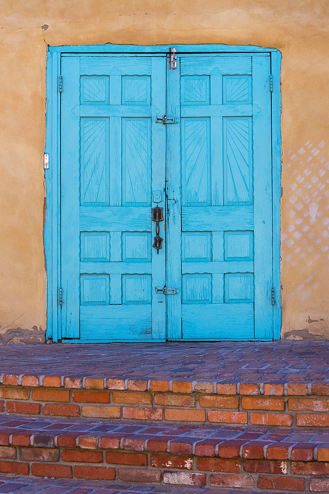 Turquoise blue doors of Old Town Emporium; Albuquerque, New Mexico.