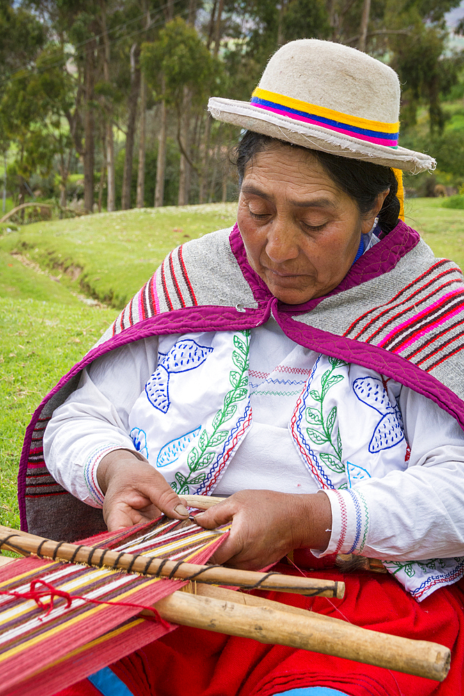 Quechua woman weaving cloth in Misminay Village, Sacred Valley, Peru.