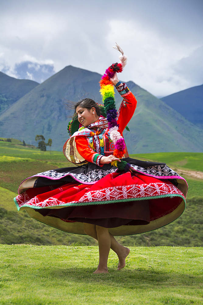 Quechua woman dancing in performance at El Parador de Moray, Sacred Valley, Peru.