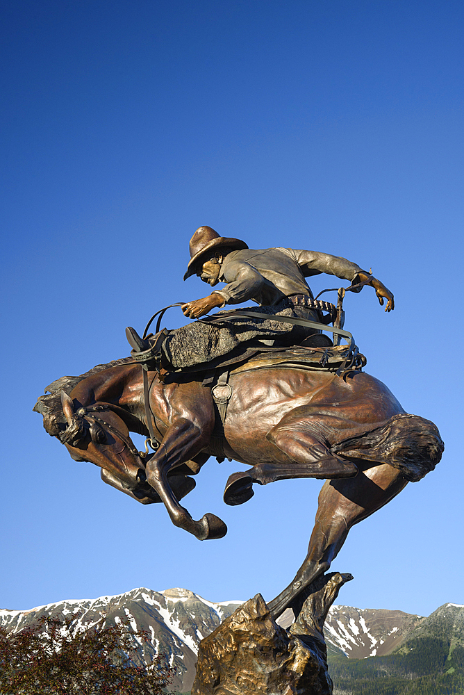 Attitude Adjustment bronze sculpture of cowboy and bucking bronco by Austin Barton in downtown Joseph, Oregon.