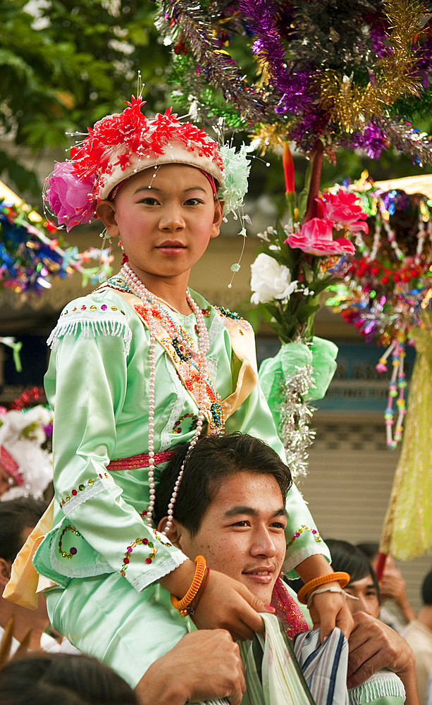 Procession and ceremony for young boys about to become novice monks by the Shan people of Burma at Wat Khun Thwong Buddhist temple in Chiang Mai, Thailand.