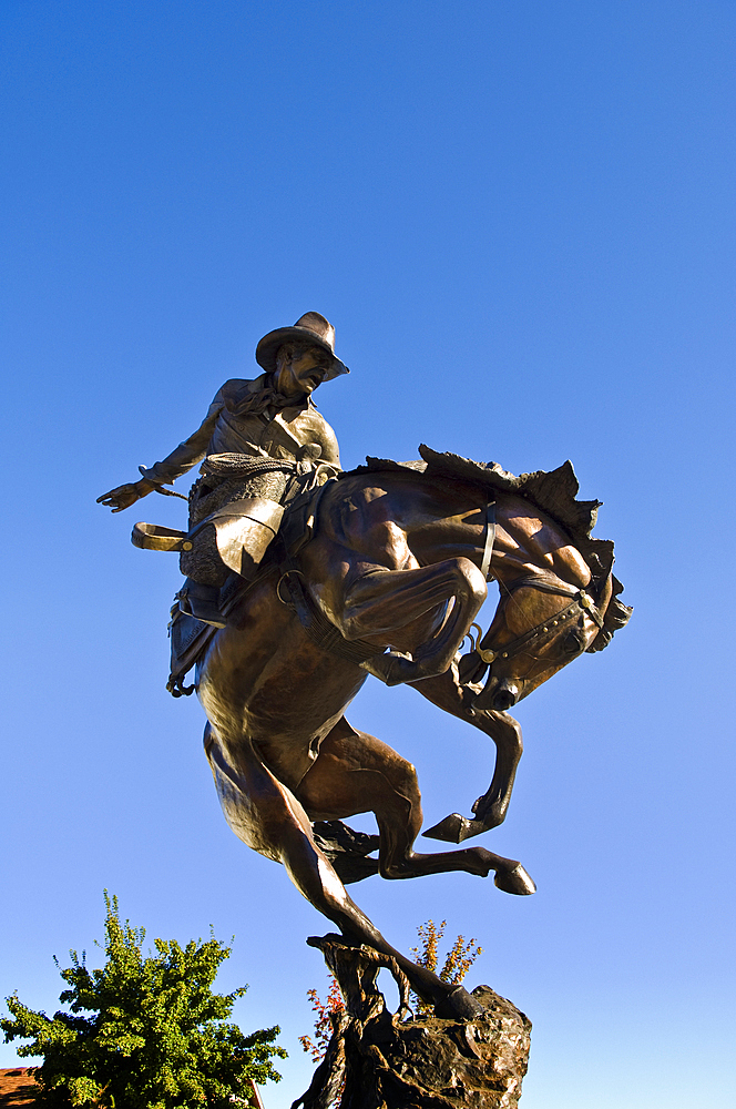 Bronze sculpture "Attitude Adjustment" by Austin Barton in front of City Hall in Joseph, Oregon.