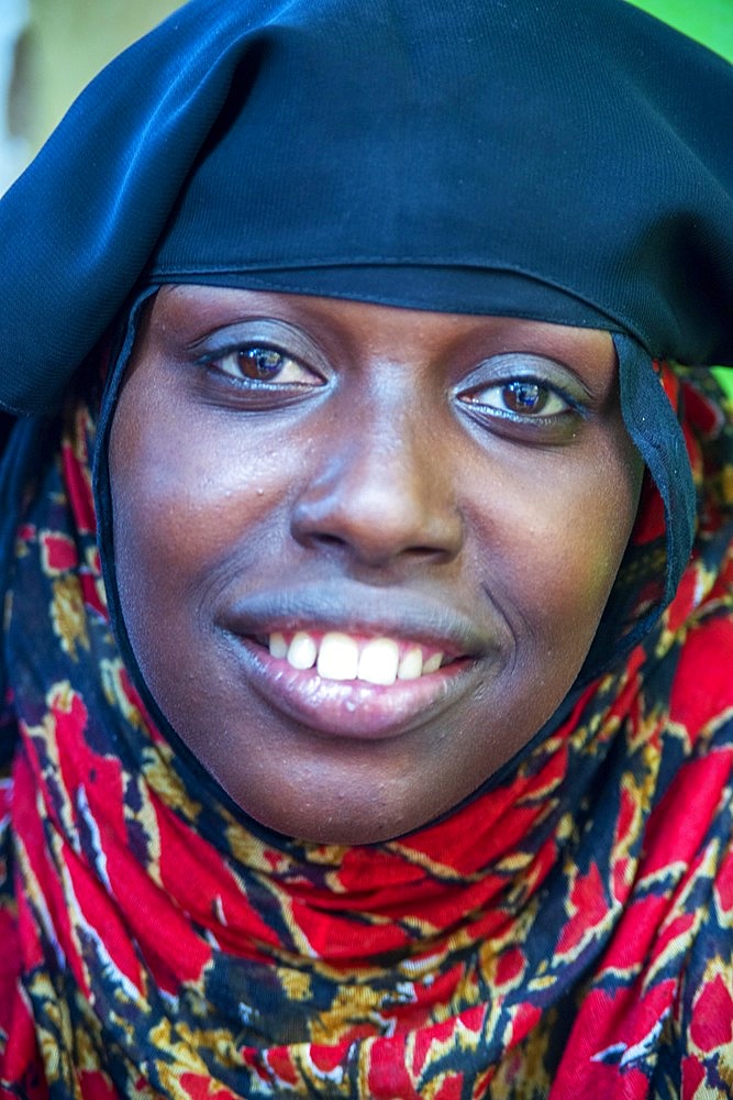 Funy swahili woman portrait in the strees of the city town of Lamu in Kenya