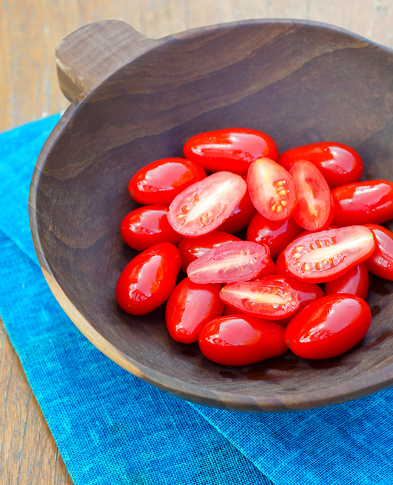 cherry tomato in a wooden bowl