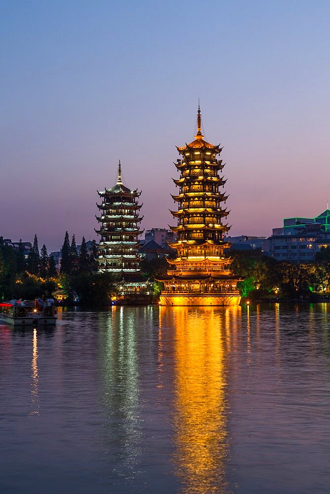 The Sun and Moon Pagodas in the center of Shanu or Fir Lake in the city of Guilin, China.