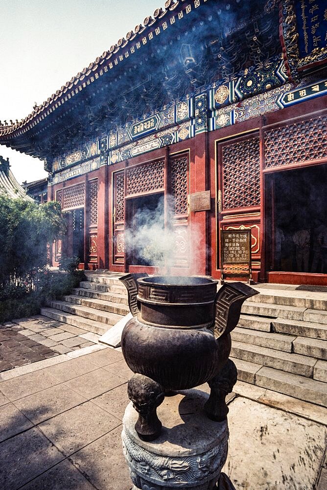 A large bronze censor of incense burner in front of the Lama Temple, a Buddhist temple in Beijing, China.