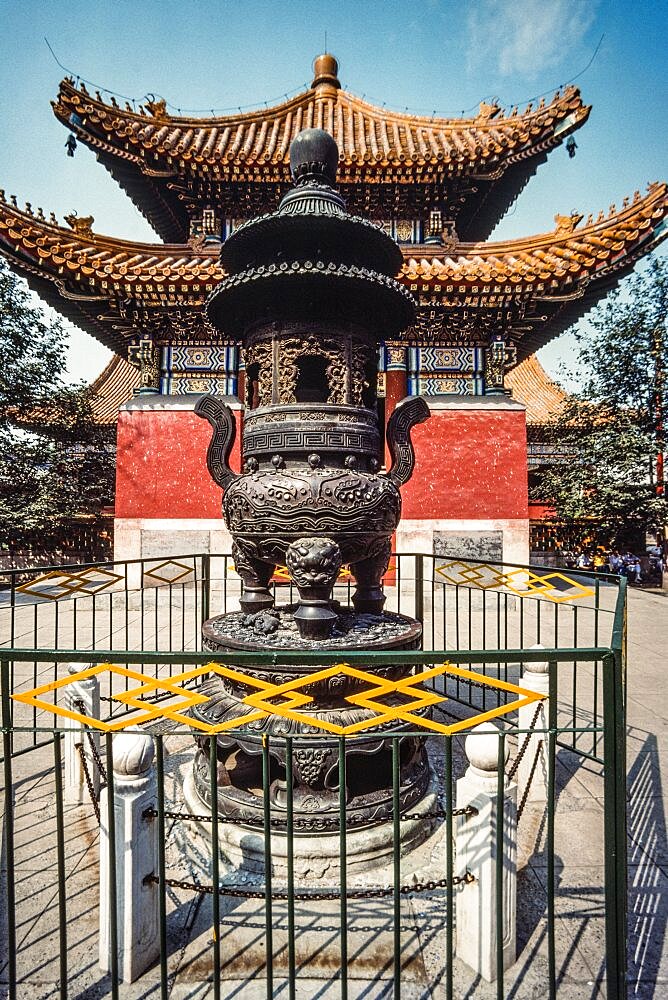 A large bronze censor of incense burner in front of the Lama Temple, a Buddhist temple in Beijing, China.