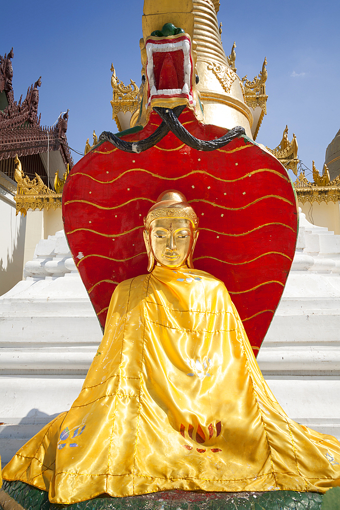 A colourful Buddha statue at Shwedagon Pagoda, Yangon, (Rangoon), Myanmar, (Burma)