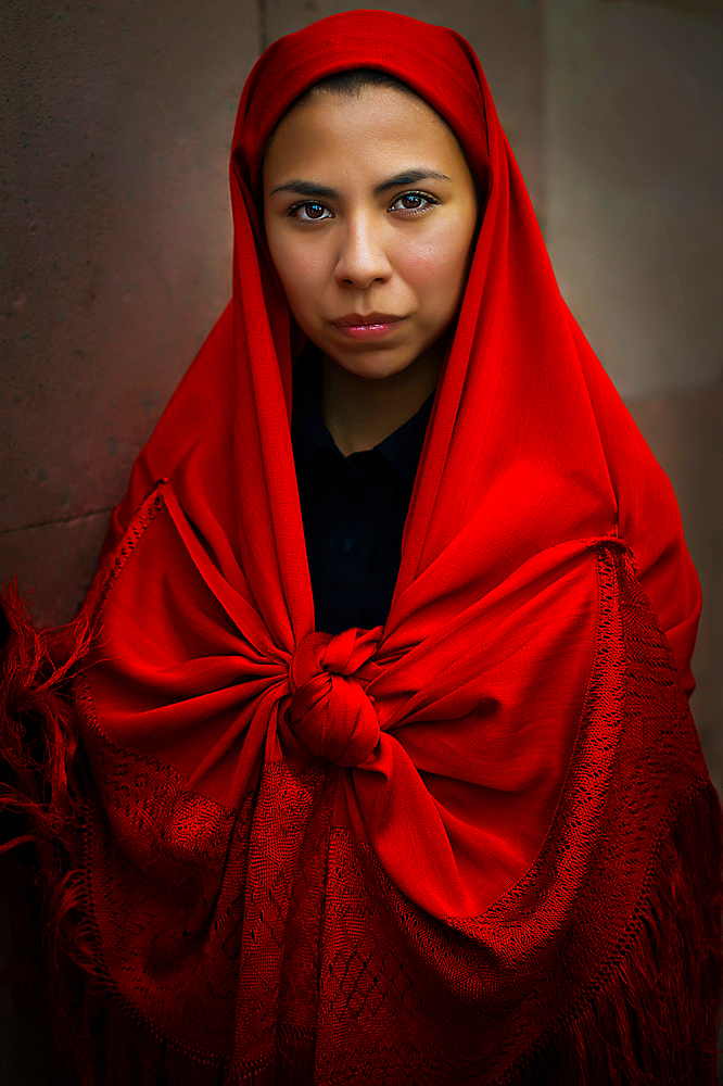 Women wearing traditional Potosi rebozos and carrying candles,