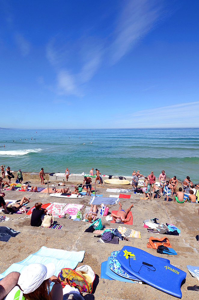 People on Cote des Basques beach at sunset, Biarritz