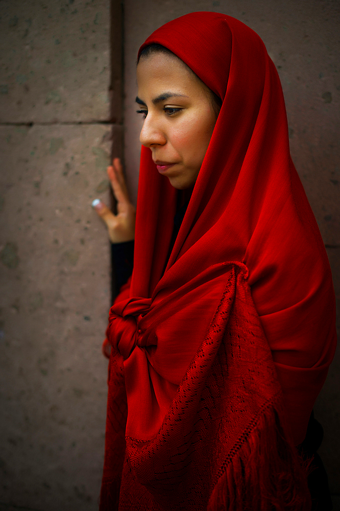 Women wearing traditional Potosi rebozos and carrying candles,