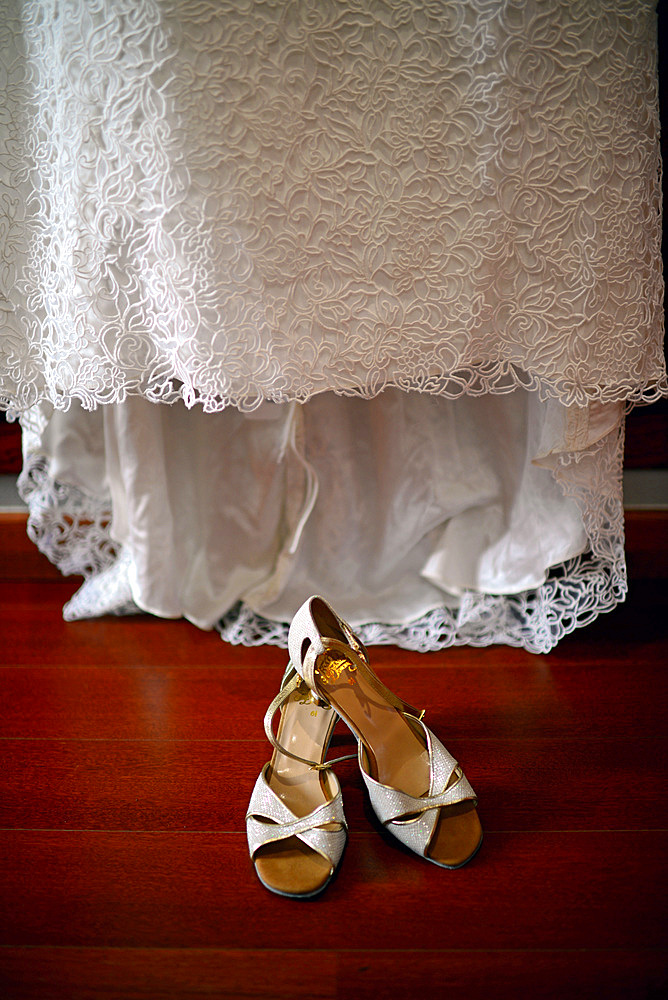 Wedding dress and shoes in room