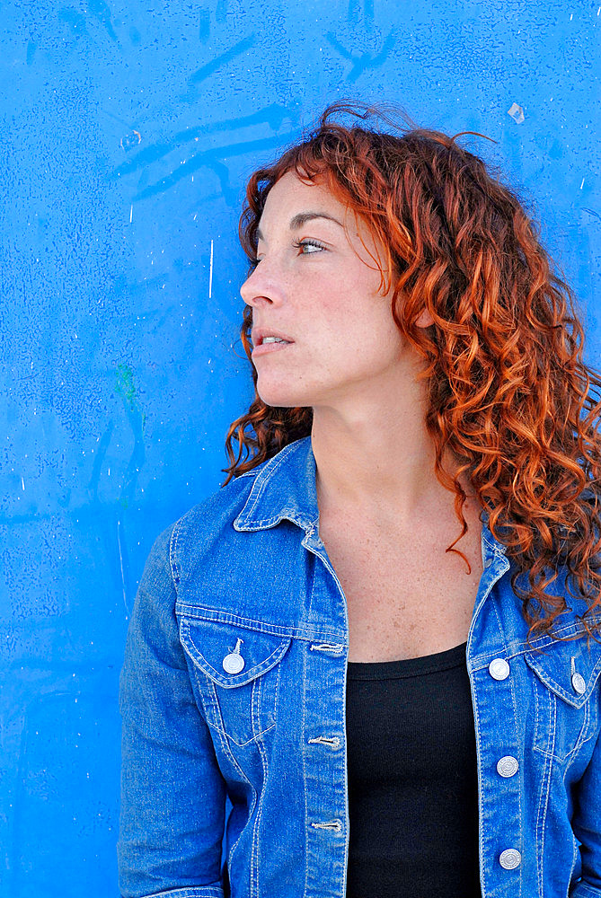 Portrait of a cute red haired girl in her twenties, Ibiza, Spain