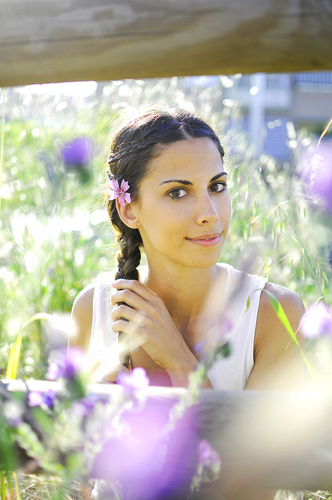 Portait of attractive young spanish woman in nature