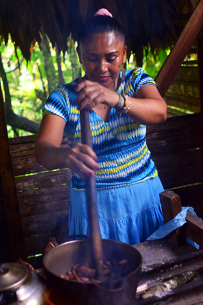 Virgilia, mother of a Bribri family, preparing natural cacao drink at tribe house, A day with the Bribri, indigenous people in Lim?n Province of Costa Rica,