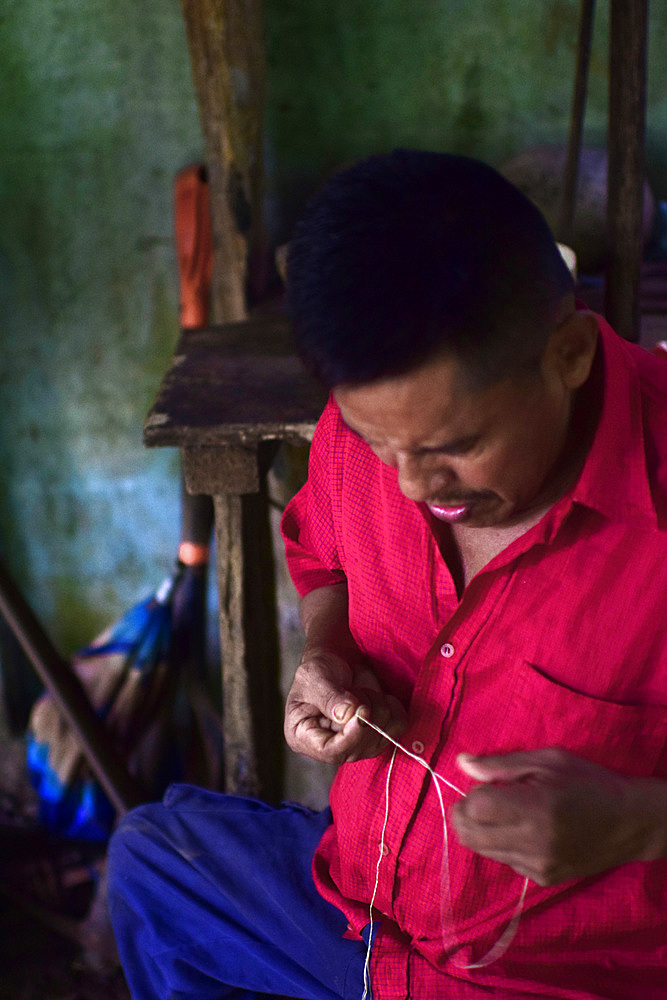 Catato L?pez, Bribri man working on handmade necklace, A day with the Bribri, indigenous people in Lim?n Province of Costa Rica