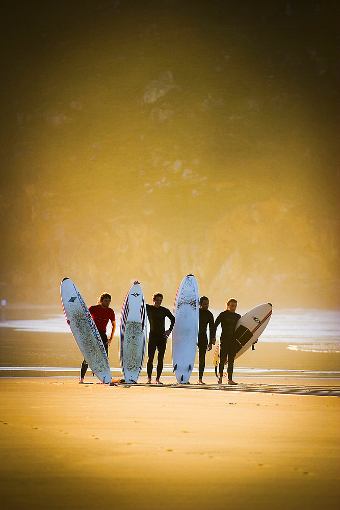 Surfers in Berria beach.
Santoￃﾱa, Cantabria, Spain.