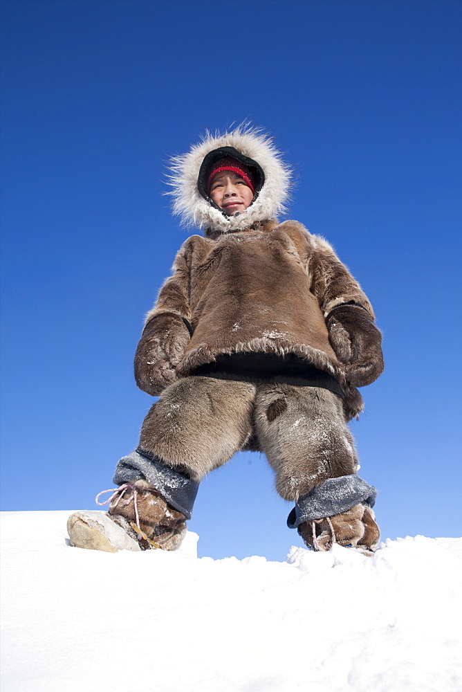 Portrait of young boy in Gojahaven, an Inuit settlement in the far north of Canada.