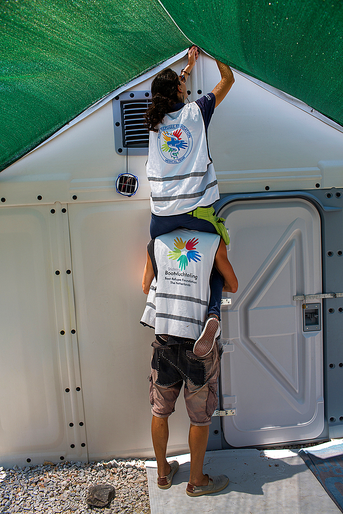 shades being distributed by Boat Refugee Foundation in Tara Tepe refugee camp in Greece