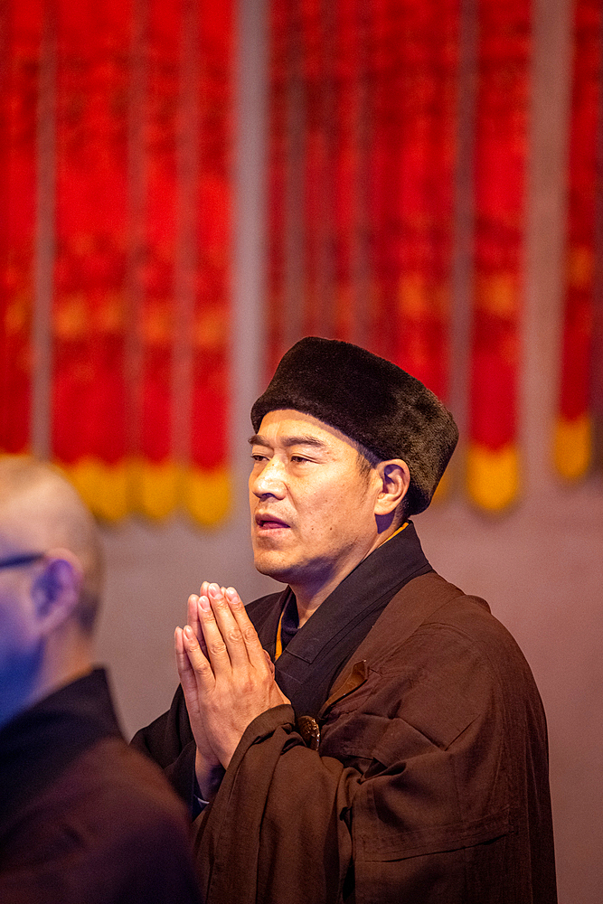 People at Jing'an Temple performing a religious ceremony, Shanghai, China