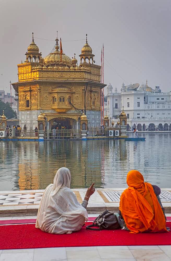 pilgrims and sacred pool Amrit Sarovar, Golden temple, Amritsar, Punjab, India