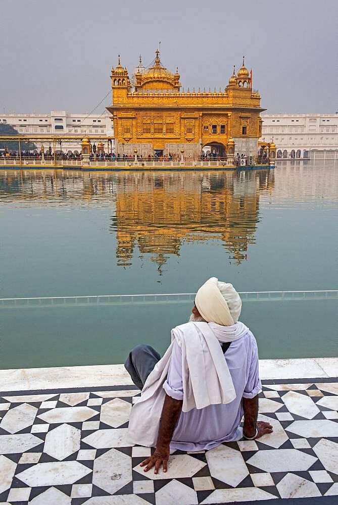 pilgrim and sacred pool Amrit Sarovar, Golden temple, Amritsar, Punjab, India