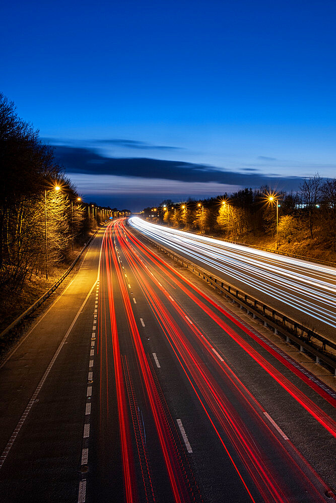 The M56 Motorway at night with traffic trails looking westbound, Cheshire, England, United Kingdom, Europe