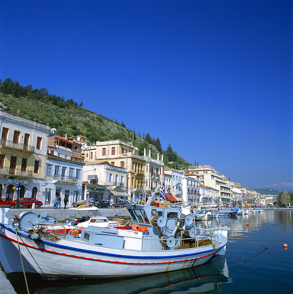 Boats and buildings on the waterfront in the seaside market and port town of Neapoli, Peloponnese, Greece, Europe