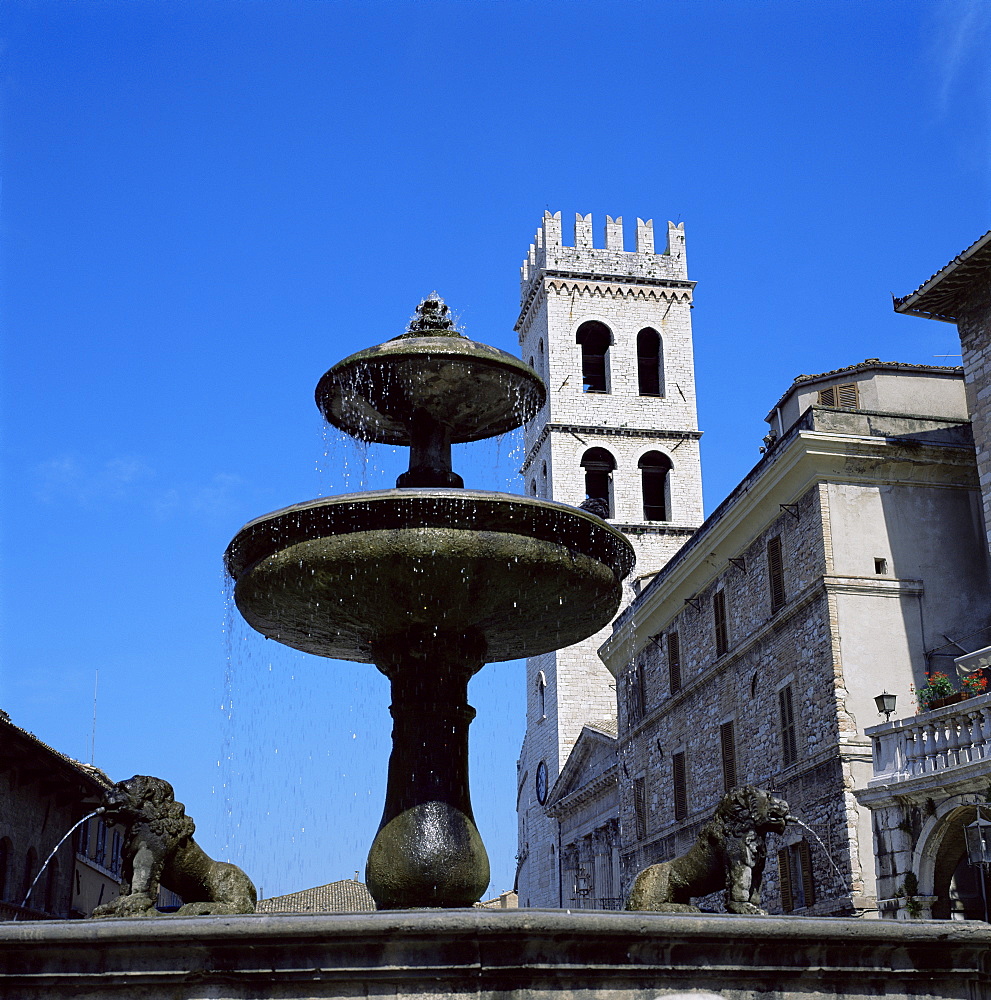 Piazza del Comune with fountain and temple of Menerva, now a church, Assisi, Umbria, Italy, Europe