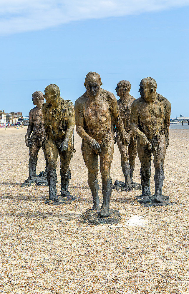 'Walking Men' artwork bronze sculptures by Laurence Edwards, South Beach, Lowestoft, Suffolk,England, UK July 2024