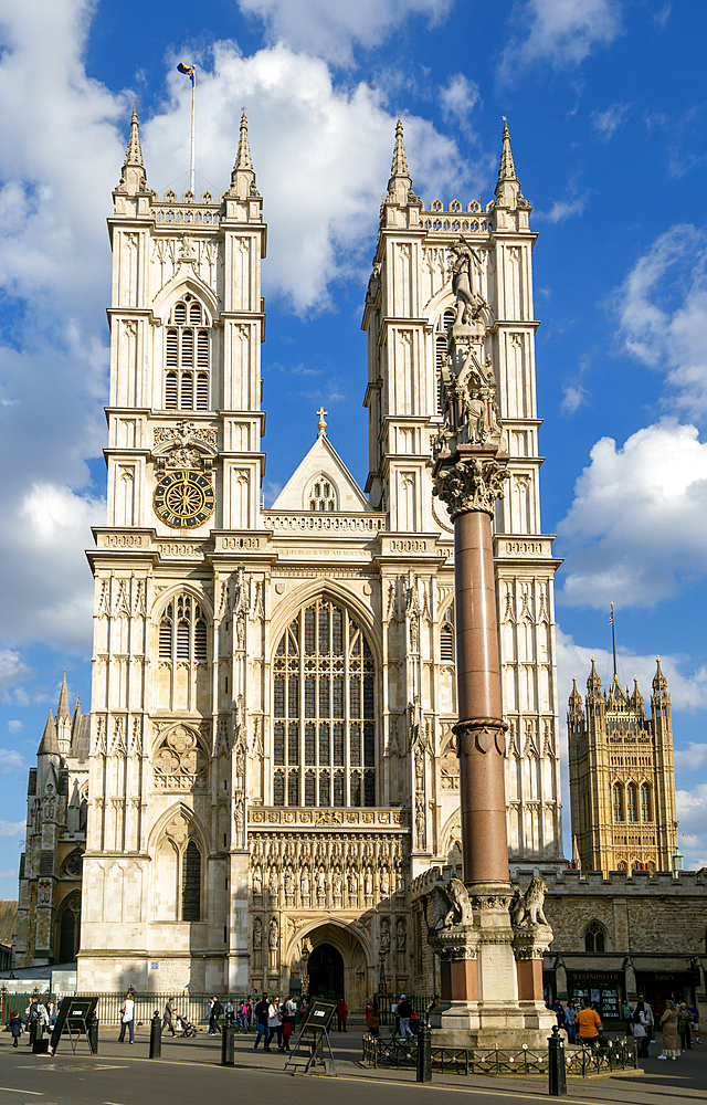Towers and frontage of Westminster abbey church with Victoria Tower in background, Westminster, London, England, UK