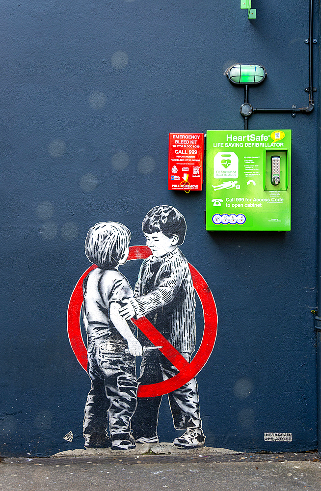 Mural street art two young boys one with knife Anti knife piece 2020 by JPS artist Jamie Scanlon, Frogmore Street, Bristol, England, UK