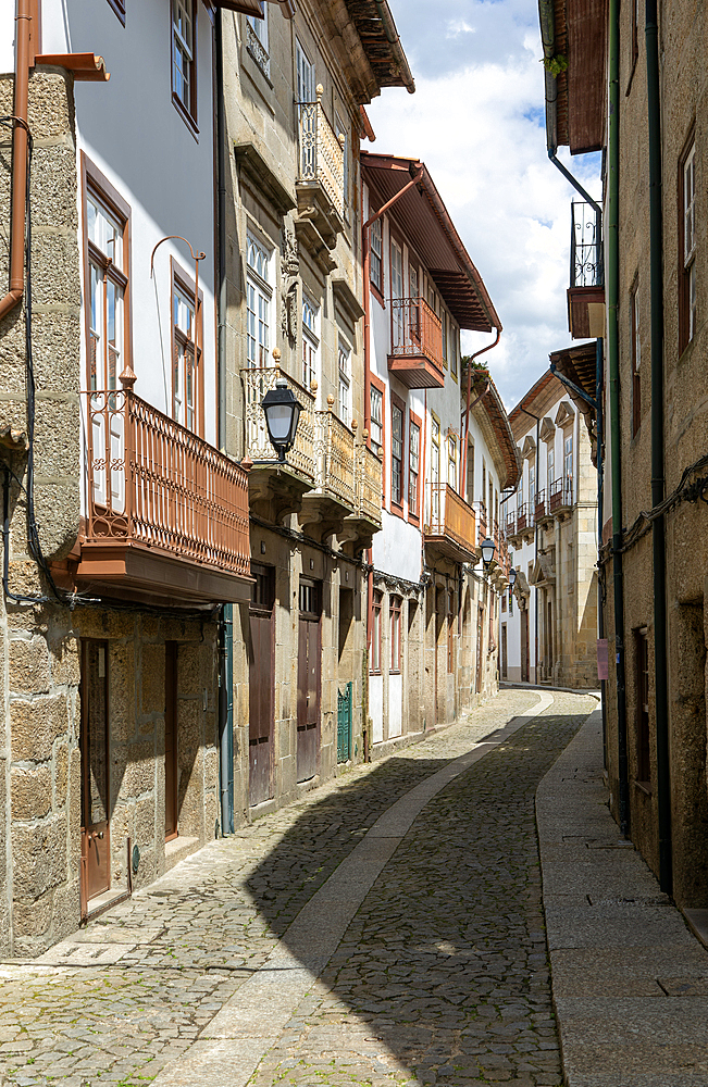 Street of historic buildings with balconies, Rua João Lopes de Faria, city centre Guimaraes, northern Portugal, Europe