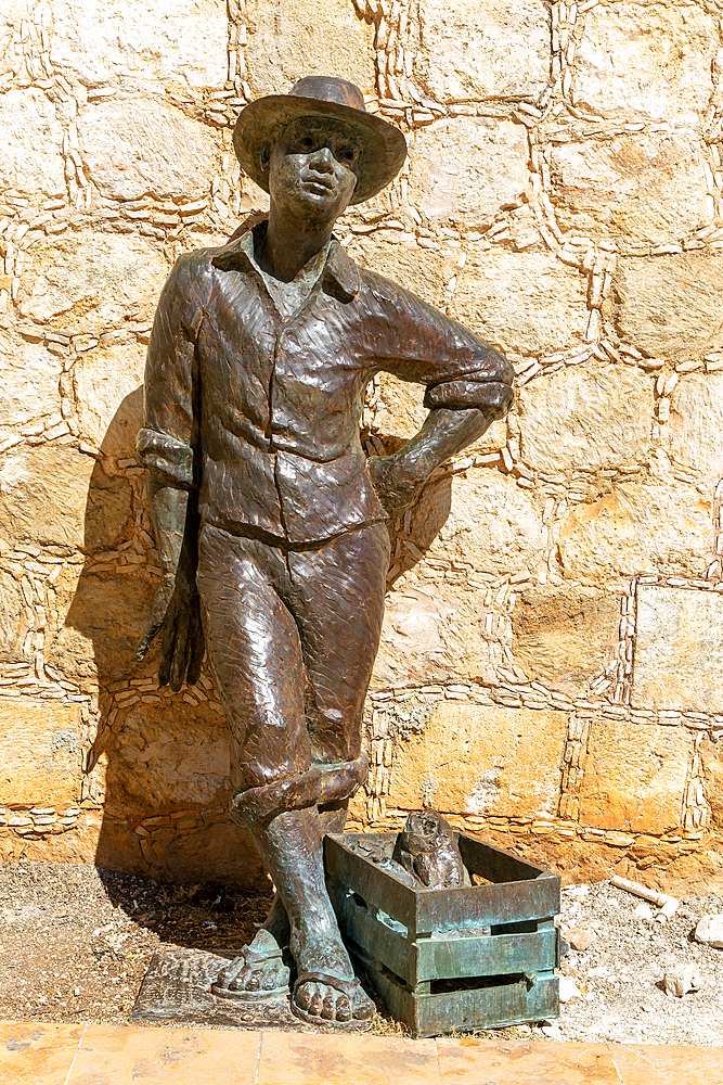 Bronze sculpture statue of a fisherman by city wall, Campeche, Campeche State, Mexico, North America