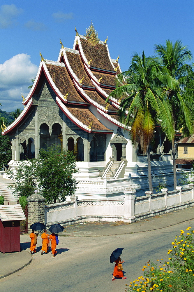 Monks in the street outside the Royal Palace Pavilion, which now serves as a museum showcase, Luang Prabang, Laos, Indochina, Southeast Asia, Asia