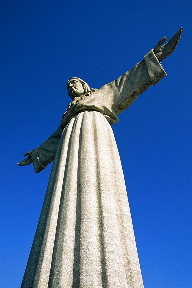 Statue of Christo Rei, 28m high, built in 1959, located in the Cacilhas suburb across the River Tejo, in Lisbon, Portugal, Europe