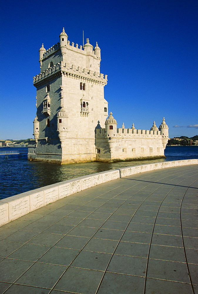 Torre de Belem (Belem Tower), dating from 16th century, designed by Francisco Arruda, UNESCO World Heritage Site, with the Tejo (Tagus) River along the Lisbon port, Belem, Lisbon, Portugal, Europe