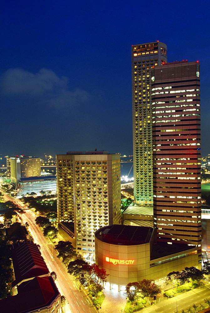 Tower and skyline at night, Raffles City, Singapore, Southeast Asia, Asia