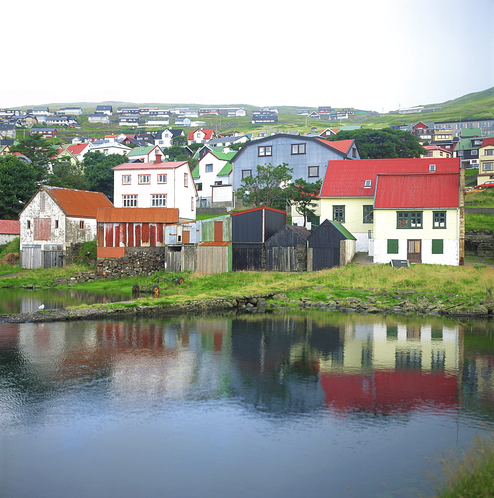 Traditional waterfront houses in the town of Westmannhavn, Stremoy Island, Faroe Islands, Denmark, Europe