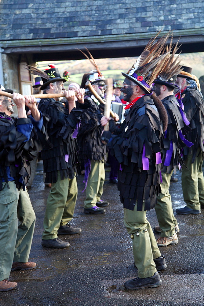 Morris dancers performing in front of the parish church in Widecombe, Dartmoor, Devon, England, United Kingdom, Europe