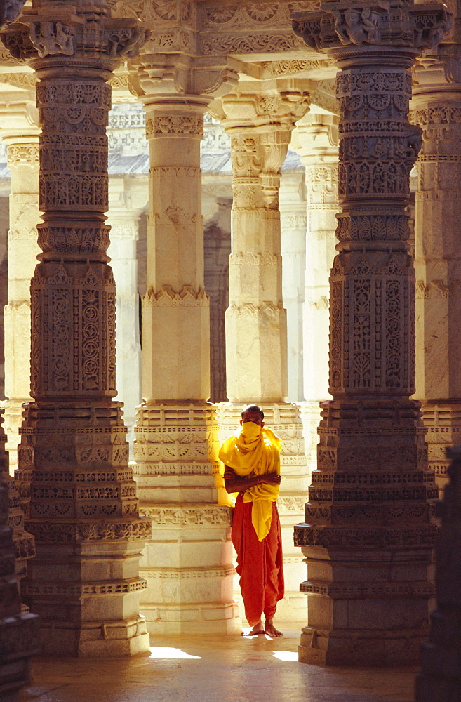 Jain covering his mouth in the interior of the Adinath Temple complex, Ranakpur, Rajasthan, India