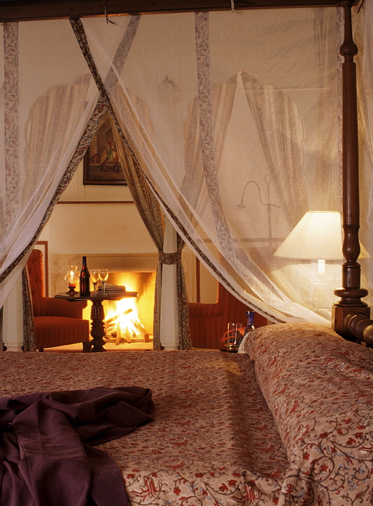 Guest bedroom, with roaring log fire lit during the winter months, Samode Palace Hotel, Samode, Rajasthan state, India, Asia