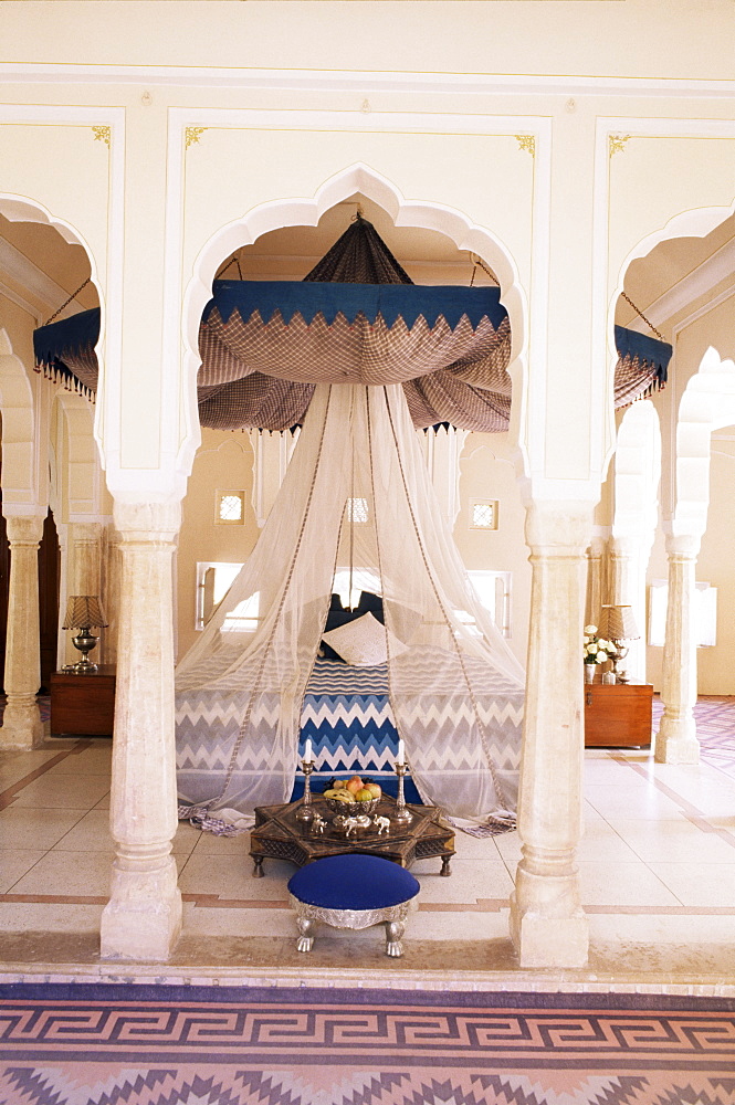 Traditional Rajput columns and cuspid arches in tented guest bedroom, Samode Palace Hotel, Samode, Rajasthan state, India, Asia