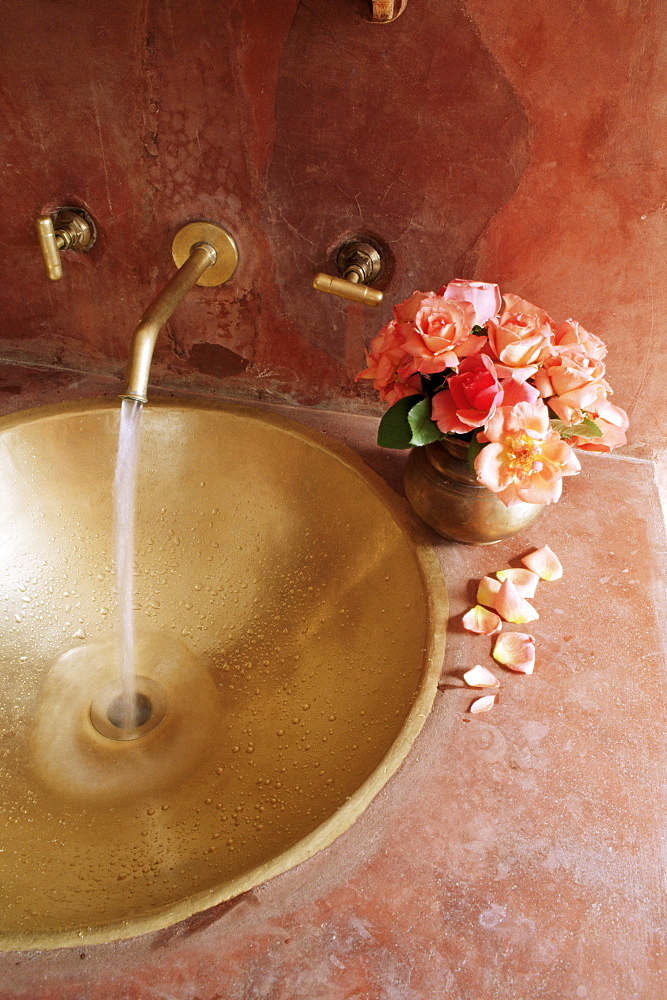 Detail of brass hand beaten bathroom sink in bathroom area of a residence, Amber, near Jaipur, Rajasthan state, India, Asia