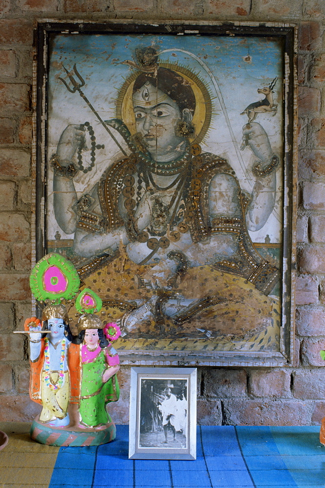 Painting of Krishna on glass, and photograph of Gandhi, in 1970s concrete structured home, Ahmedabad, Gujarat state, India, Asia