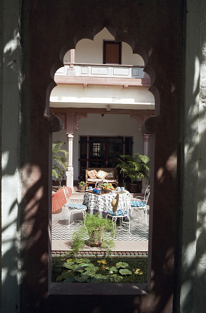 Old architectural stone salvage has been incorporated into the structure of new build home, near Jaipur, Rajasthan state, India, Asia