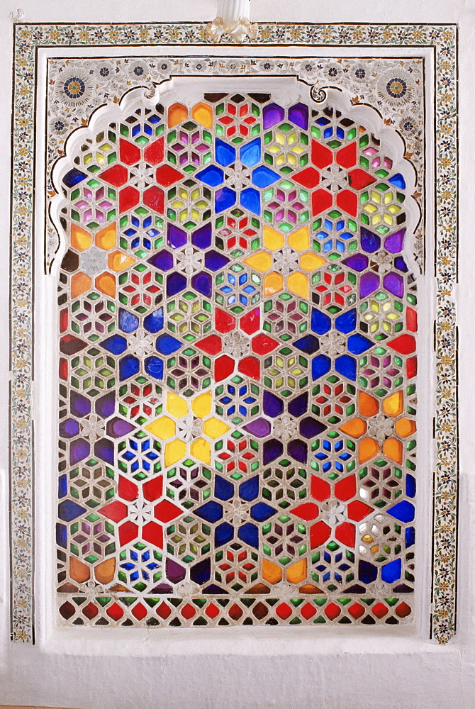 Coloured glass Jali in hallway within the palace, Deo Garh Palace Hotel, Deo Garh (Deogarh), Rajasthan state, India, Asia