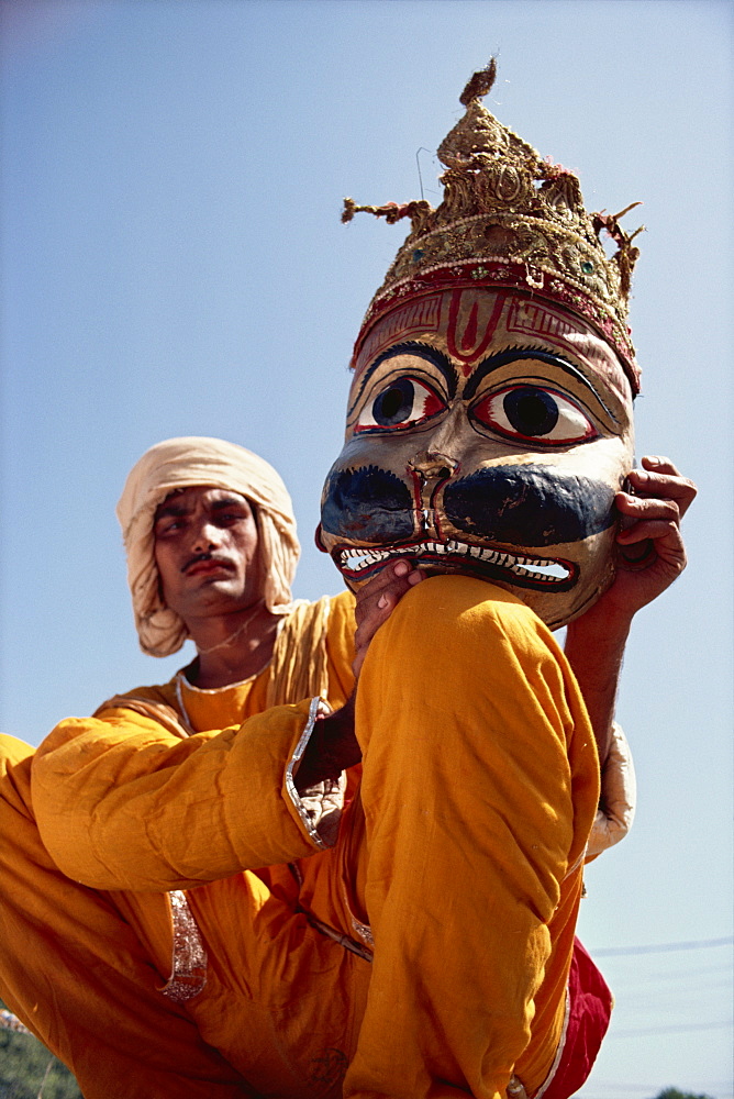 Actor with mask worn in the Ramlilla, the stage play of the Hindu epic the Ramayana, Varanasi, Uttar Pradesh state, India, Asia