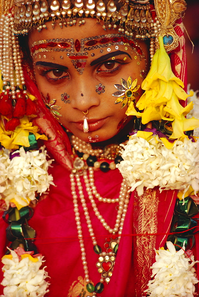 Portrait of a young actor in jewels and make-up as Sita, wife of Rama, from the Ramlilla, the stage play of the great Hindu Epic, the Ramayana, Varanasi (Benares), Uttar Pradesh State, India